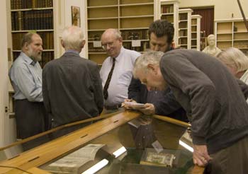 Delegates examing Bibles at the Founders' Library.