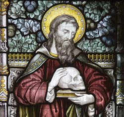 Detail of St Luke from a stained glass window.