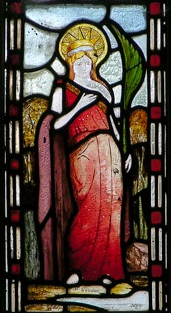 Window showing St Wenog at the West end of the church.